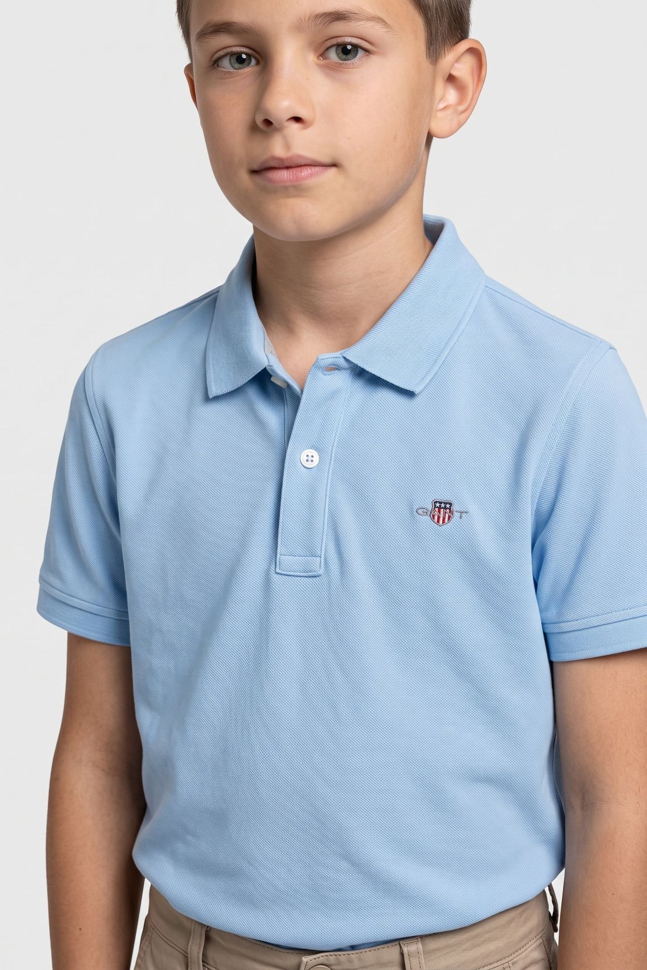 TEEN UNISEX SHIELD PIQUE SS POLO SHIRT SKY BLUE 1