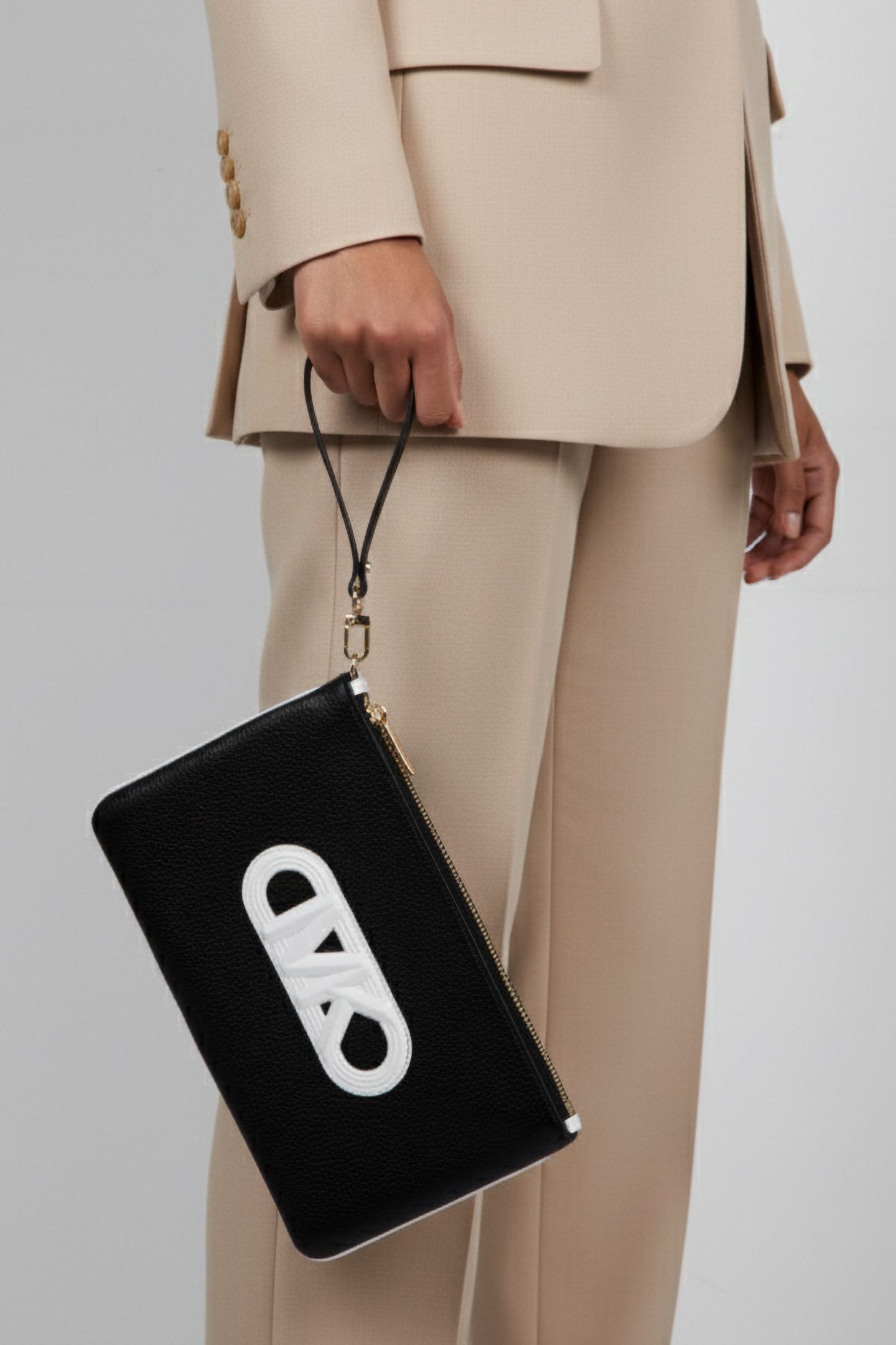 LEATHER TOP ZIP WRISTLET IN BLACK AND WHITE 1