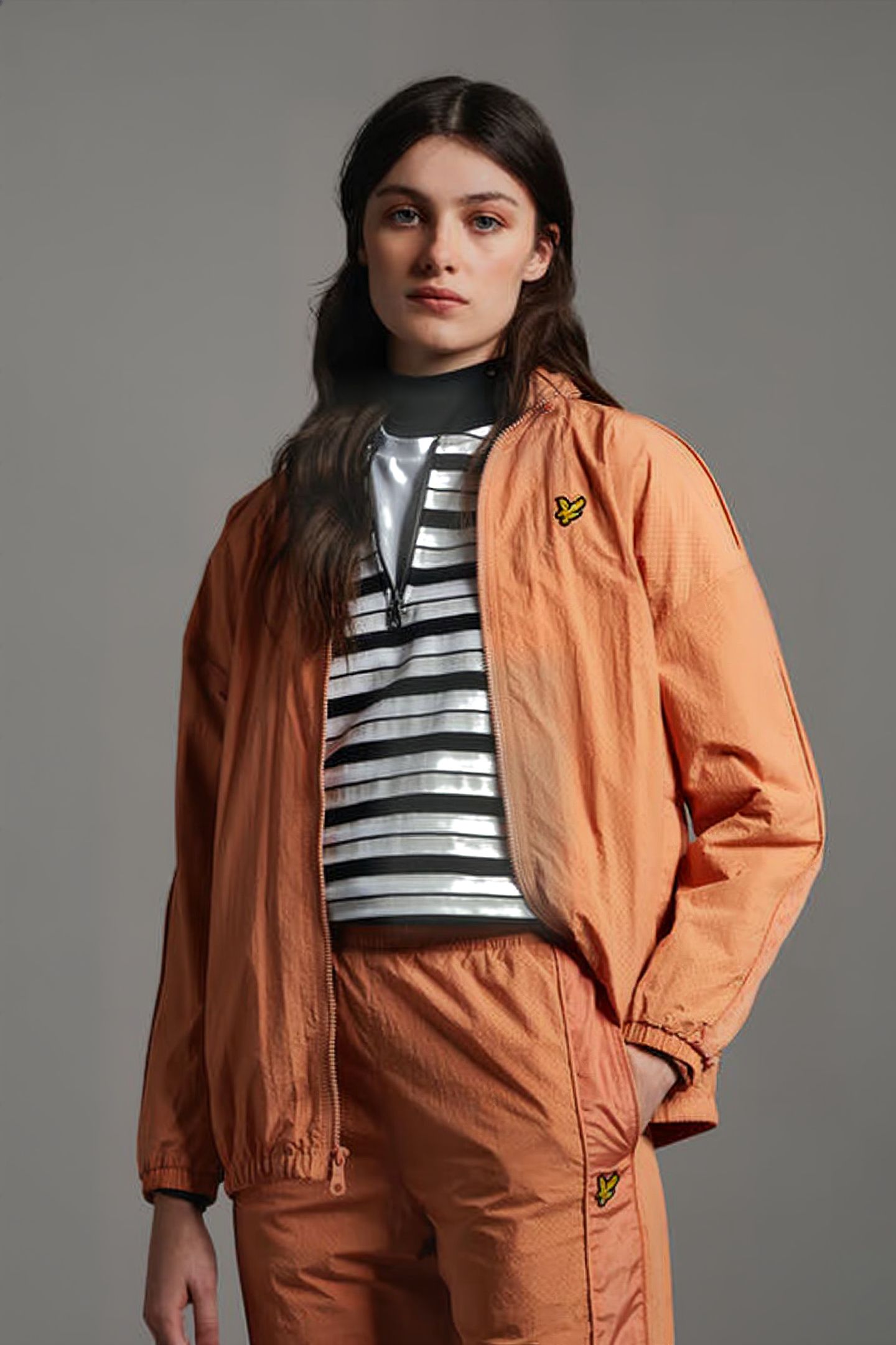 PERFORATED FUNNEL NECK JACKET DUSK ORANGE 1