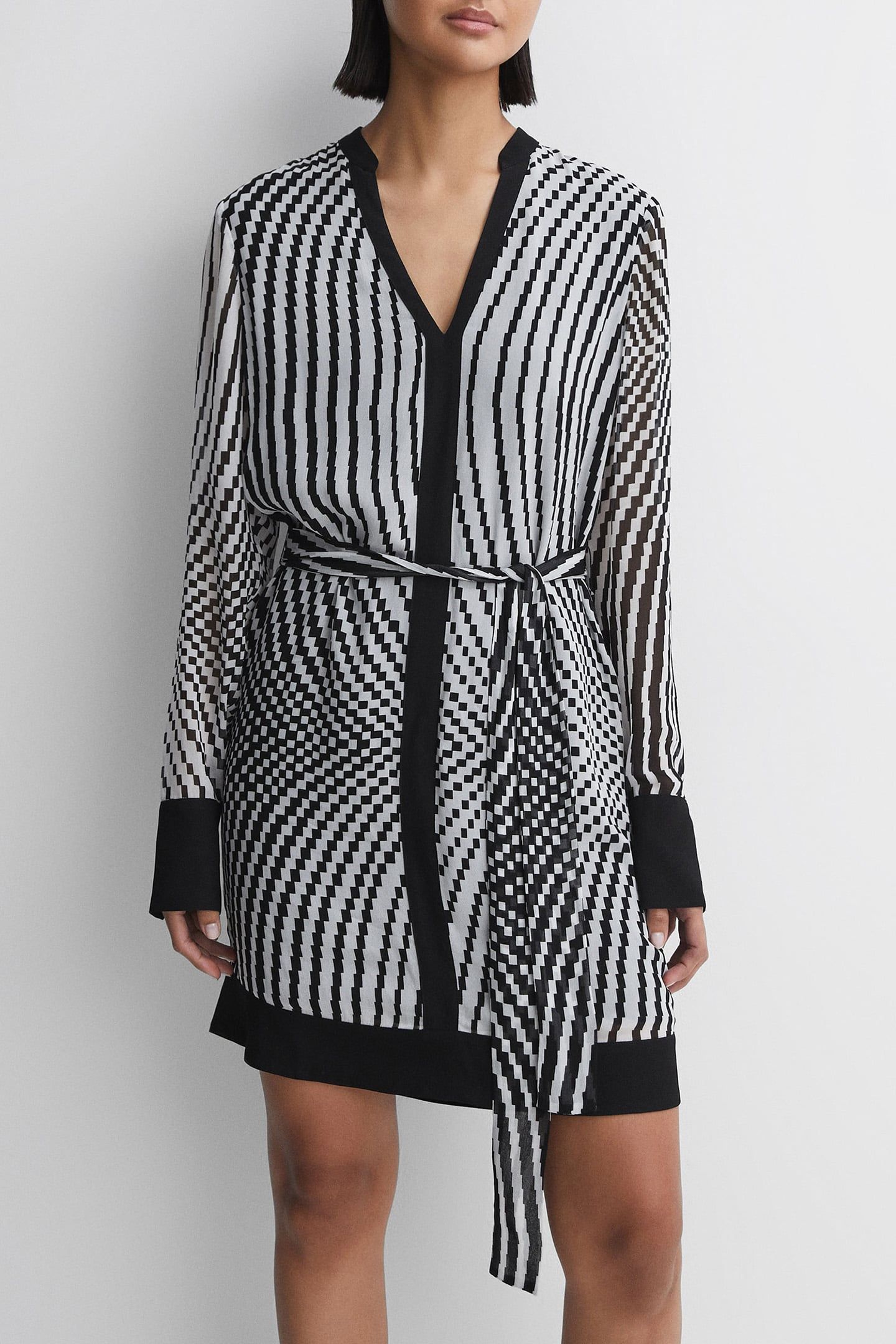 CHECK FLIPPY MINI DRESS — THE MODEL IS WEARING A SIZE 8 1