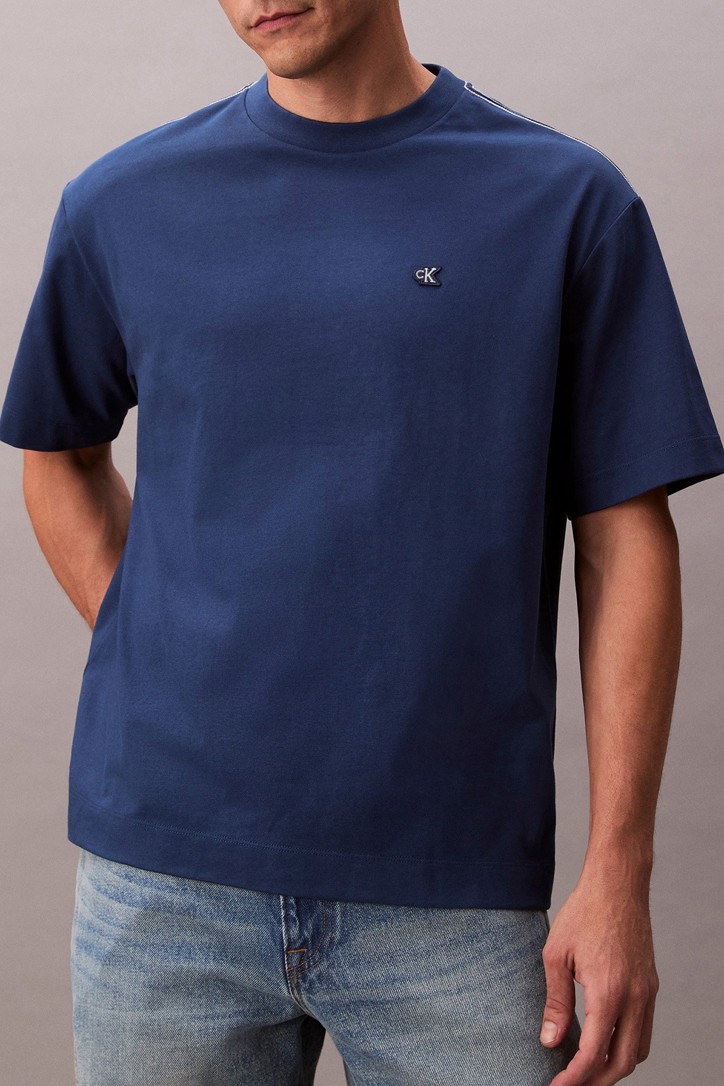 SS TOPSTITCH EMB PAT BLUE JEAN by Calvin Klein