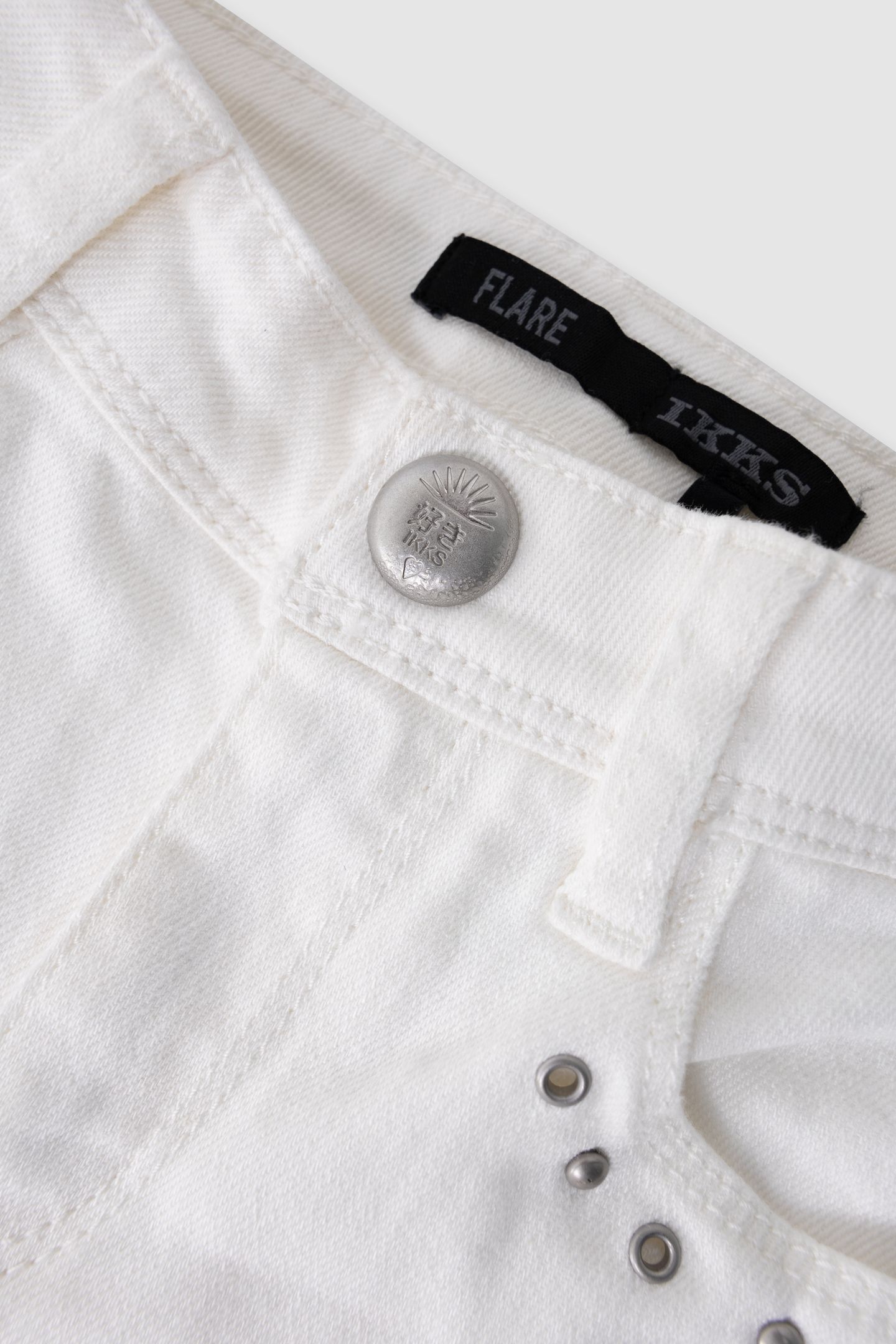 FLARE ECRU JEANS WITH STUD AND EYELET DECORATION 5