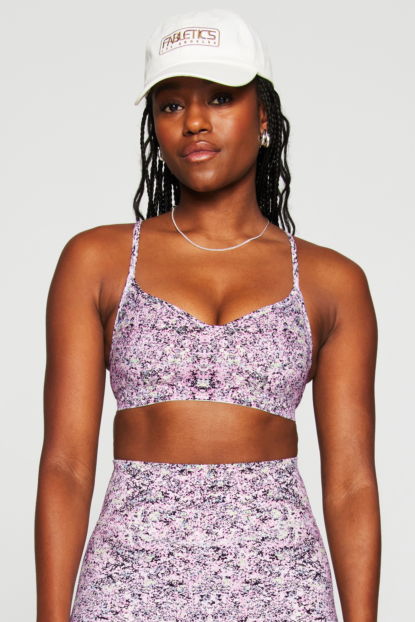 Fabletics Sleek Seamless Low Impact Bra Cosmic Splatter Maat: XS REG | Sport BH's Outlet | Dames | Roze
