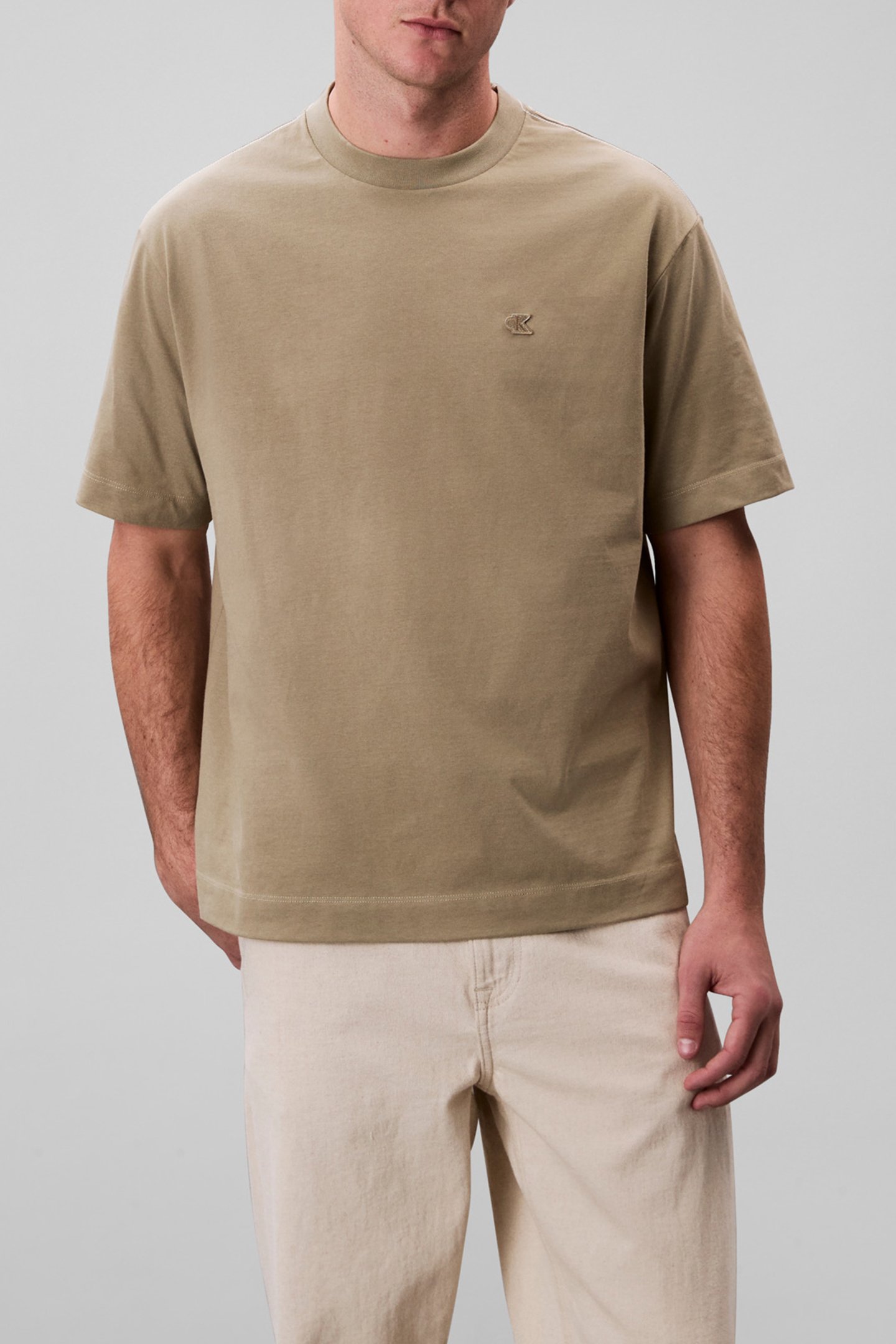 SS TOPSTITCH EMB PAT OVERLAND TREK by Calvin Klein