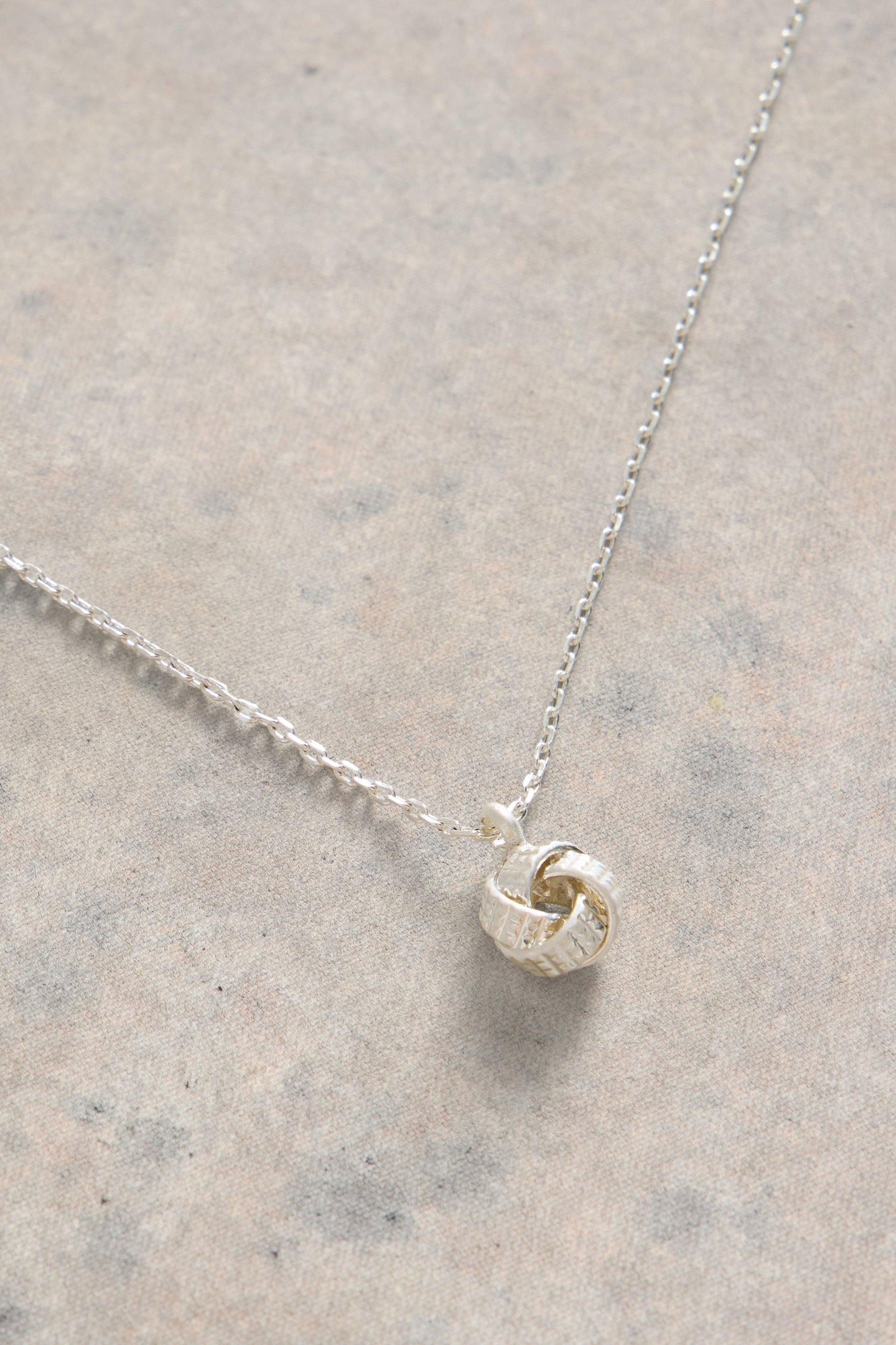 KNOT CHARM FINE NECKLACE SILVER TONE METALLIC 1